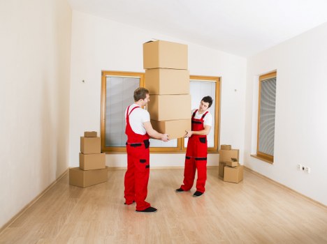 A moving vehicle and packed boxes ready for a removals service in Finsbury Park