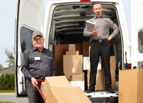 Student removals team handling boxes in Finsbury Park near local housing