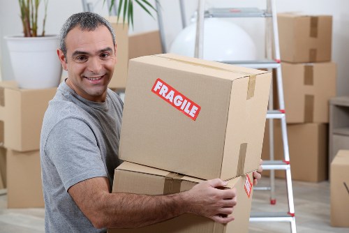 Removal team using safety equipment during a house move in Finsbury Park