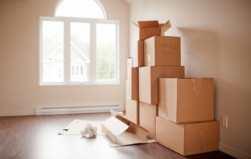 Commercial relocation with desks, boxes, and IT equipment