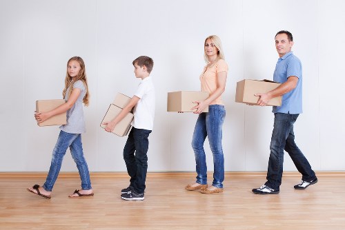 Packed moving boxes and furniture ready for local home removal service